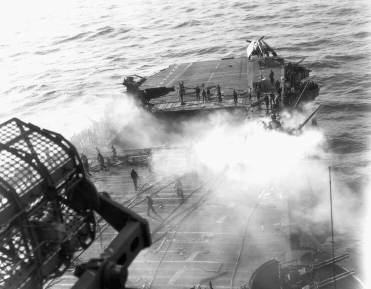 Flight deck of the USS Enterprise (CV 6) burning as a result of a Kamikaze attack, May 14, 1945. (Photo Credits: Historical / Corbis / Getty Images).