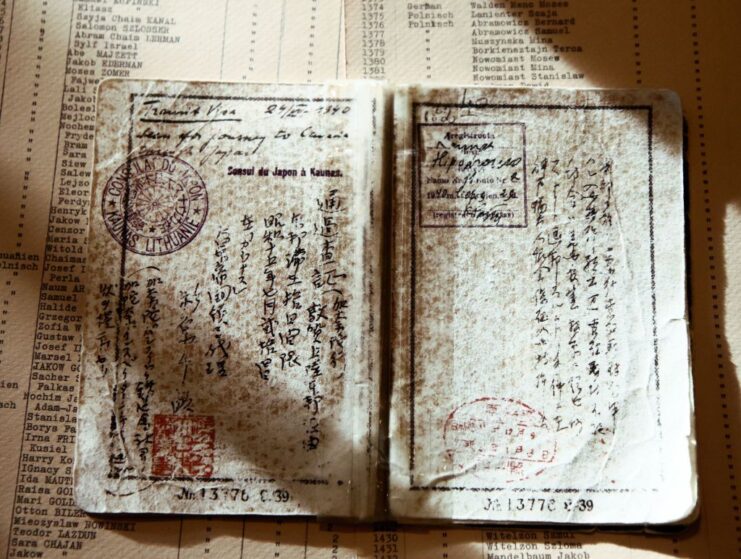 Travel document placed atop another document on a table