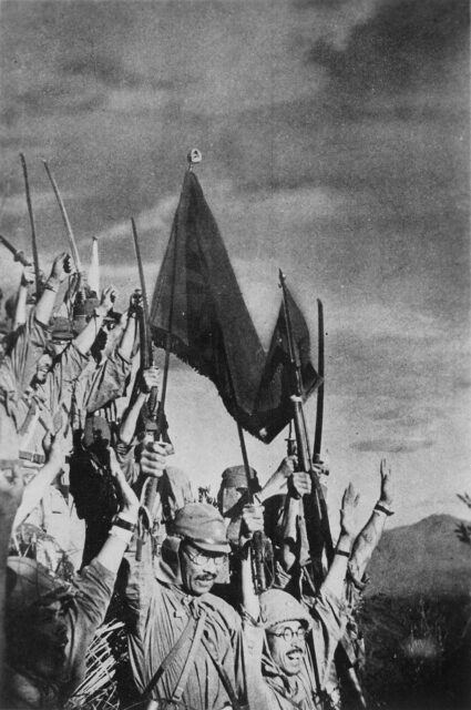 Japanese soldiers holding up their swords and flags