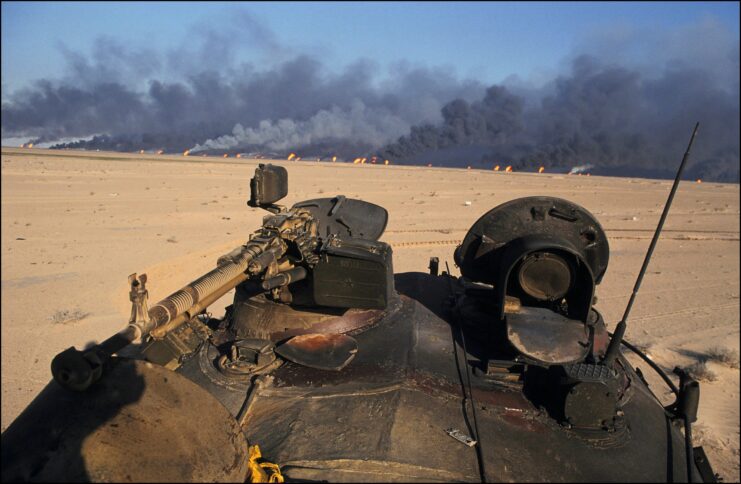 Oil fields on fire on the road from Kuwait City to Basrah, US soldiers.