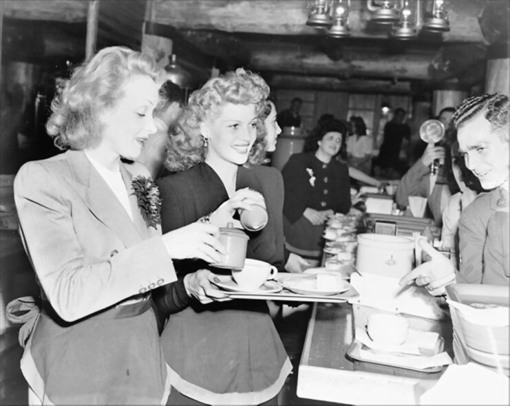 Marlene Dietrich and Rita Hayworth serving troops at the Hollywood Canteen