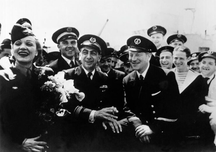 Marlene Dietrich and Jean Gabin surrounded by French sailors