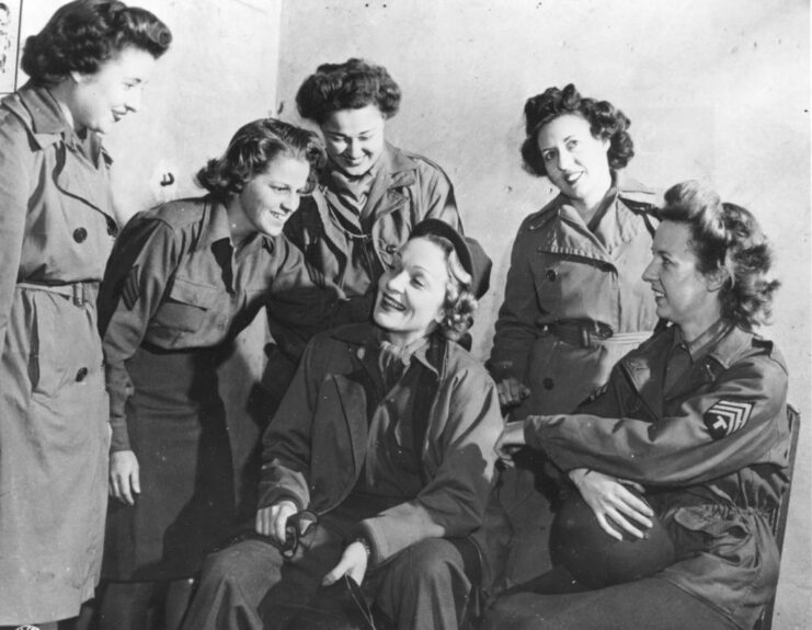 Members of the Women's Army Corps (WAC) standing around Marlene Dietrich