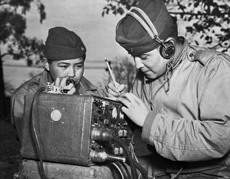 Two Navajo code talkers working at a portable radio