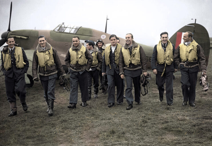 Members of the No 303 Squadron RAF walking away from an aircraft