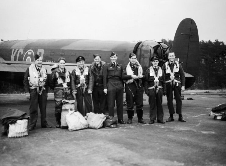 Members of the No. 617 Squadron RAF standing in front of an Avro Lancaster B Mark I (Special)