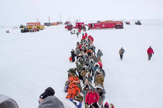 US Navy personnel lining up in the snow during Operation Deep Freeze 2015