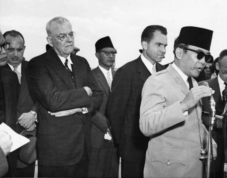 President Sukarno speaking at a microphone.