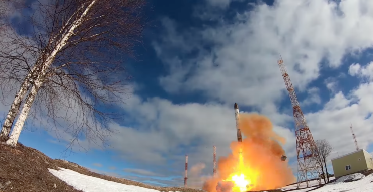 RS-28 Sarmat intercontinental ballistic missile (ICBM) being launched on a semi-cloudy day