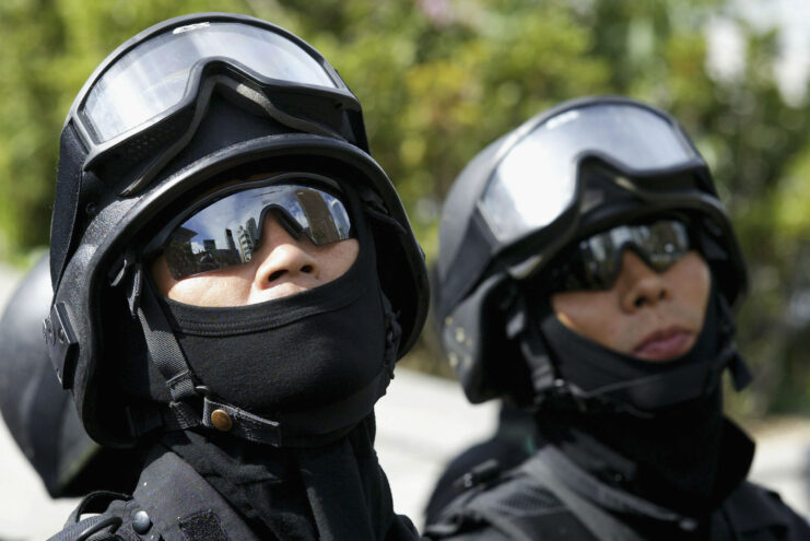 Two South Korean SWAT team members wearing sunglasses.