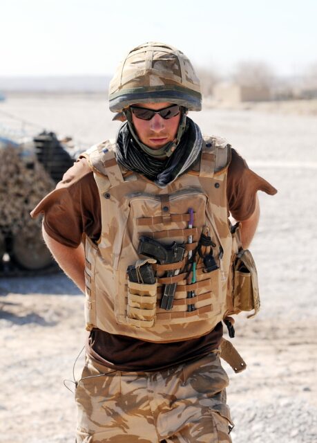 Prince Harry wearing sunglasses while serving in Afghanistan.