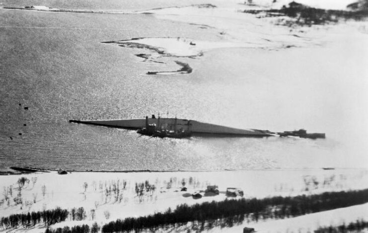 Aerial view of Tirpitz capsized in the water, off the coast of Håkøya