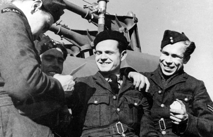 Four members of the No 303 Squadron RAF standing in uniform