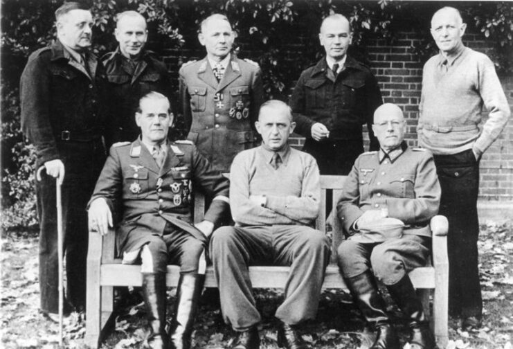 Dietrich von Choltitz, Gerhard Wilck, Hermann-Bernhard Ramcke, Knut Eberding, Eberhard Wildermuth, Rüdiger von Heyking, Karl-Wilhelm von Schlieben and Wilhelm Daser standing together near a large hedge