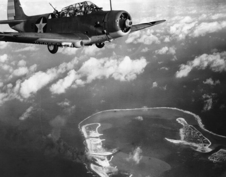 A VT-6 Douglas TBD Devastator torpedo bomber flying over Wake Island. 