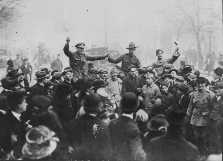 French, American and British soldiers celebrating in their military uniforms