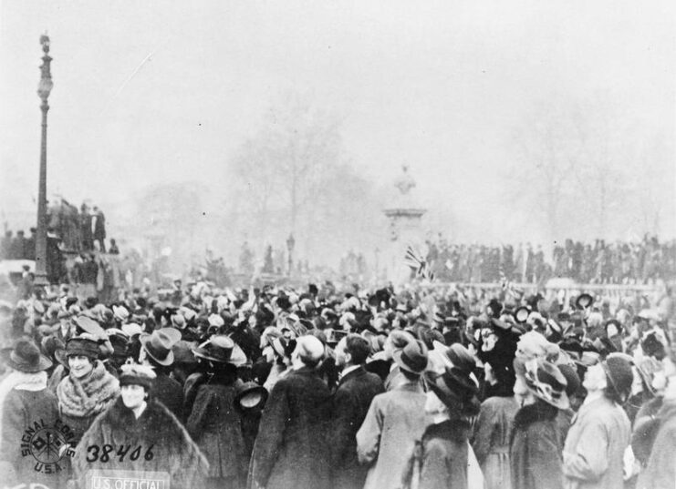 British citizens standing outside of Buckingham Palace