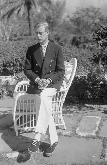 Edward VIII sitting on the arm of a chair