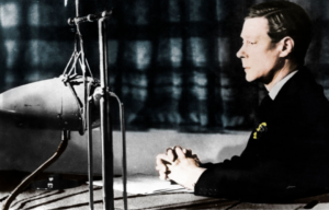 Edward VIII sitting before a microphone that's been placed on a desk