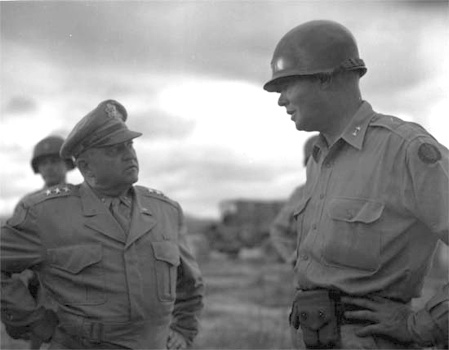 Eighth Army Commander Lieutenant General Walton Walker (left) is met by Major General William Dean at an advance airfield near Taejon, July 7, 1950.