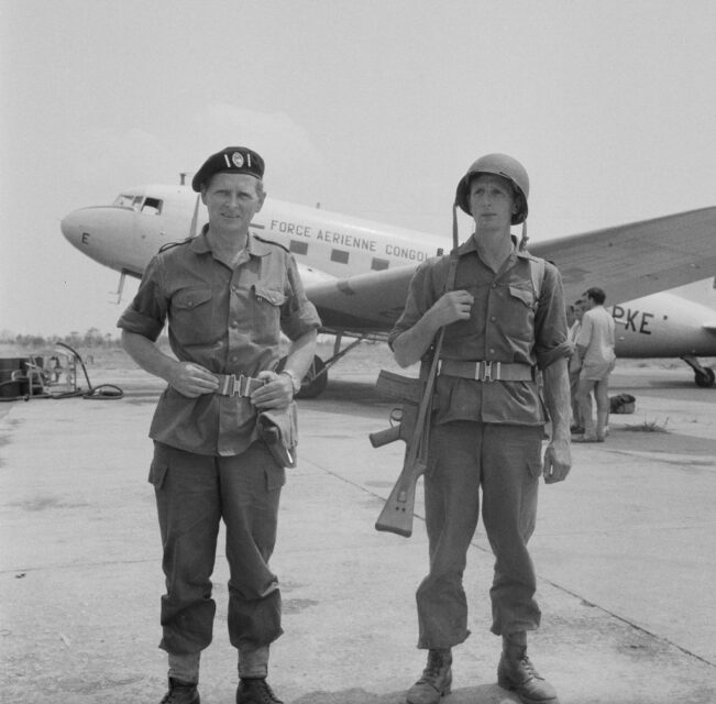 Mike Hoare and Donald Grant standing near an aircraft