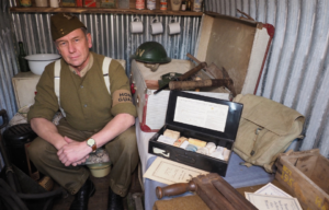 Trad Casey sitting in an Anderson Shelter