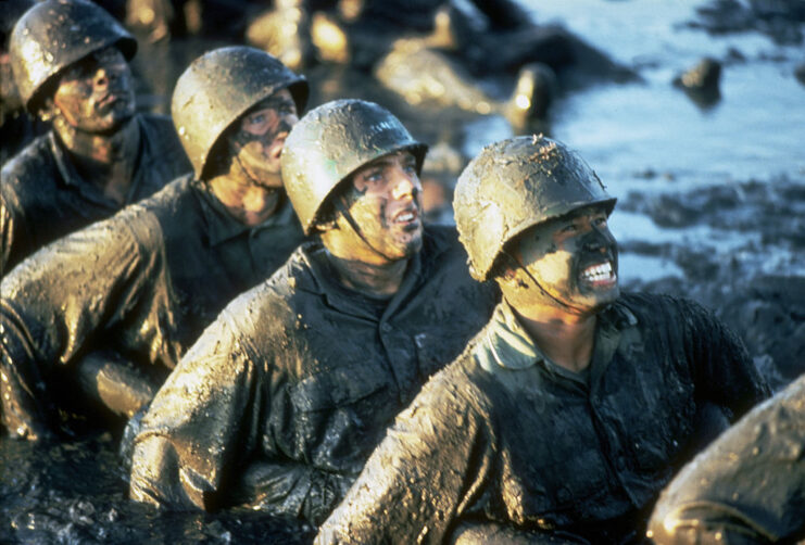 US Navy SEAL recruits covered in mud