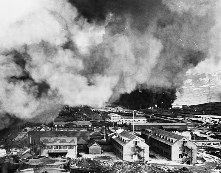 Smoke rising above buildings