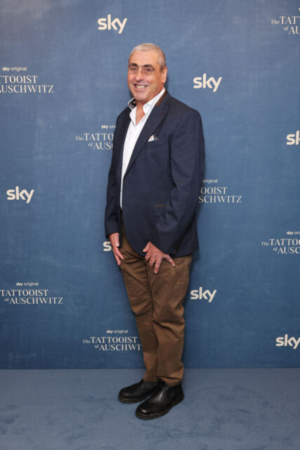 Gary Sokolov standing on a red carpet