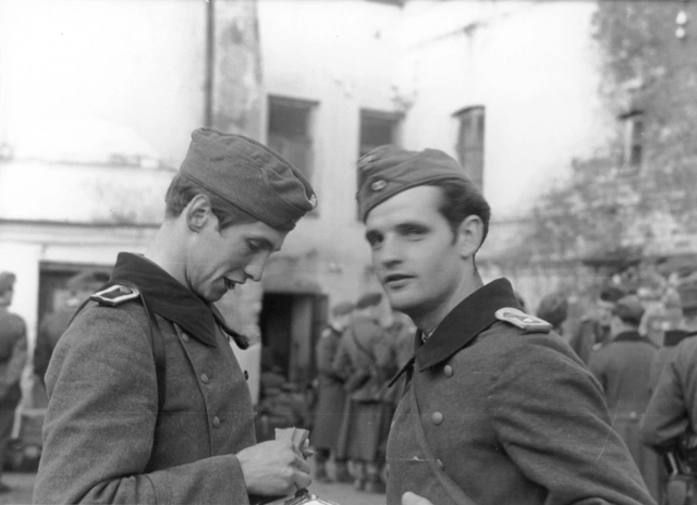 Hans Scholl and Alexander Schmorell standing together in their military uniforms