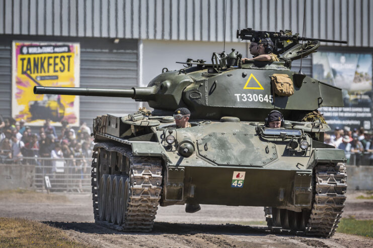 M24 Chaffee driving along a dirt track