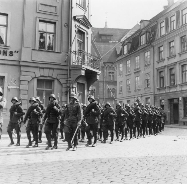 German troops marching through a city street