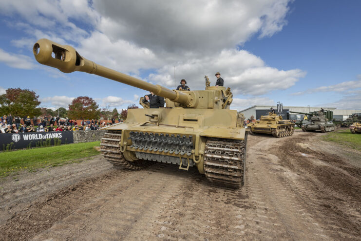 Tiger 131 leading a line of tanks around a dirt track