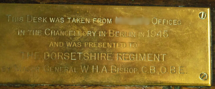 Close-up of a gold desk plaque