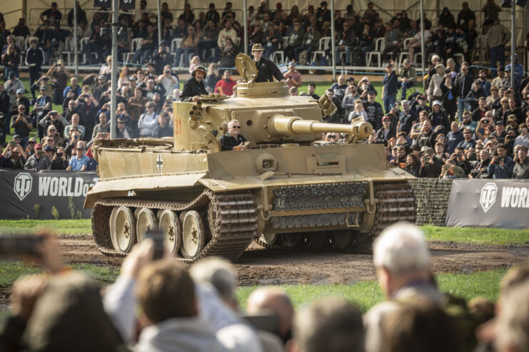 Crowd watching Tiger 131 drive around a dirt track